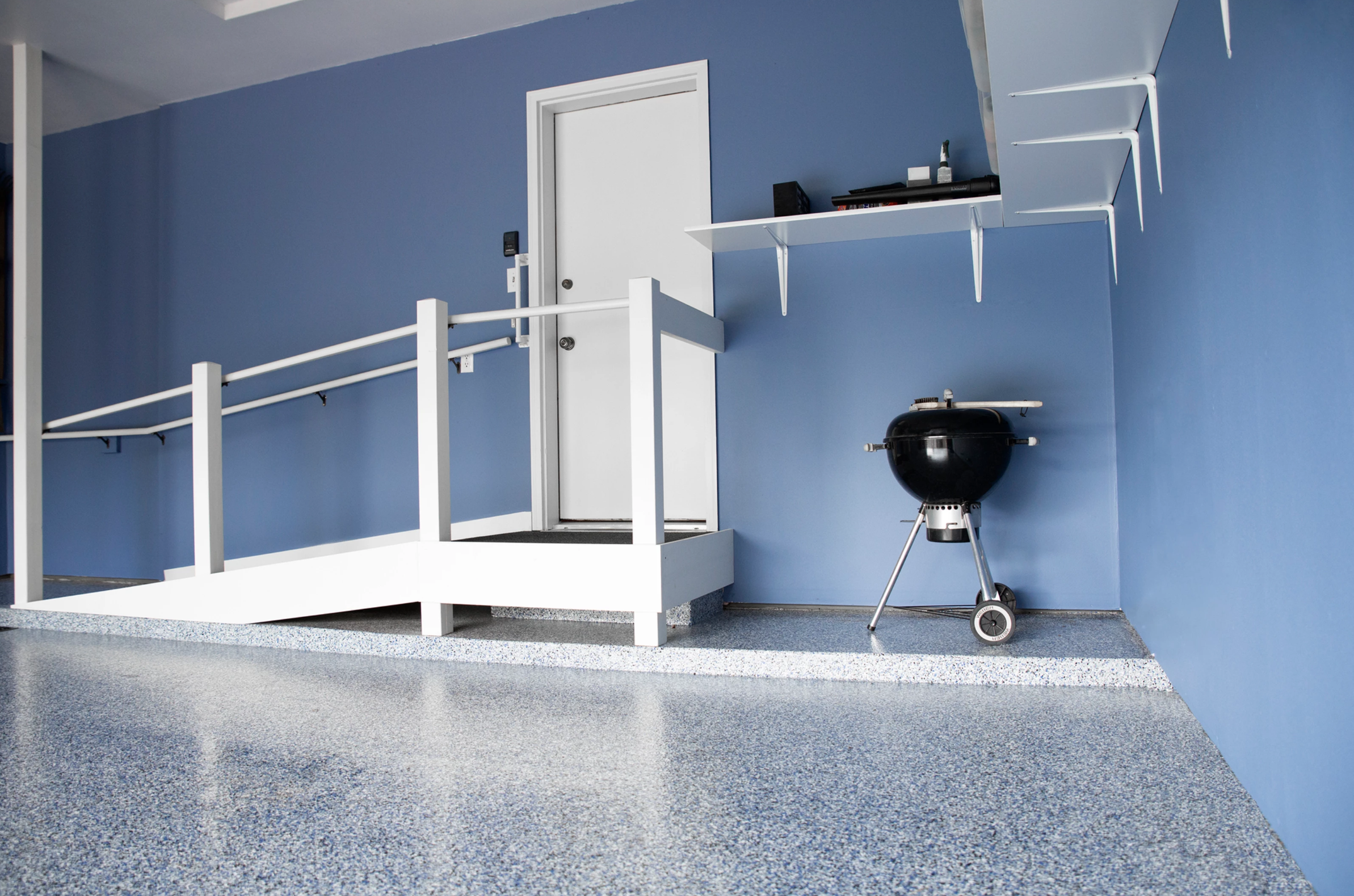 Garage epoxy floor installation — durable coating with flake finish