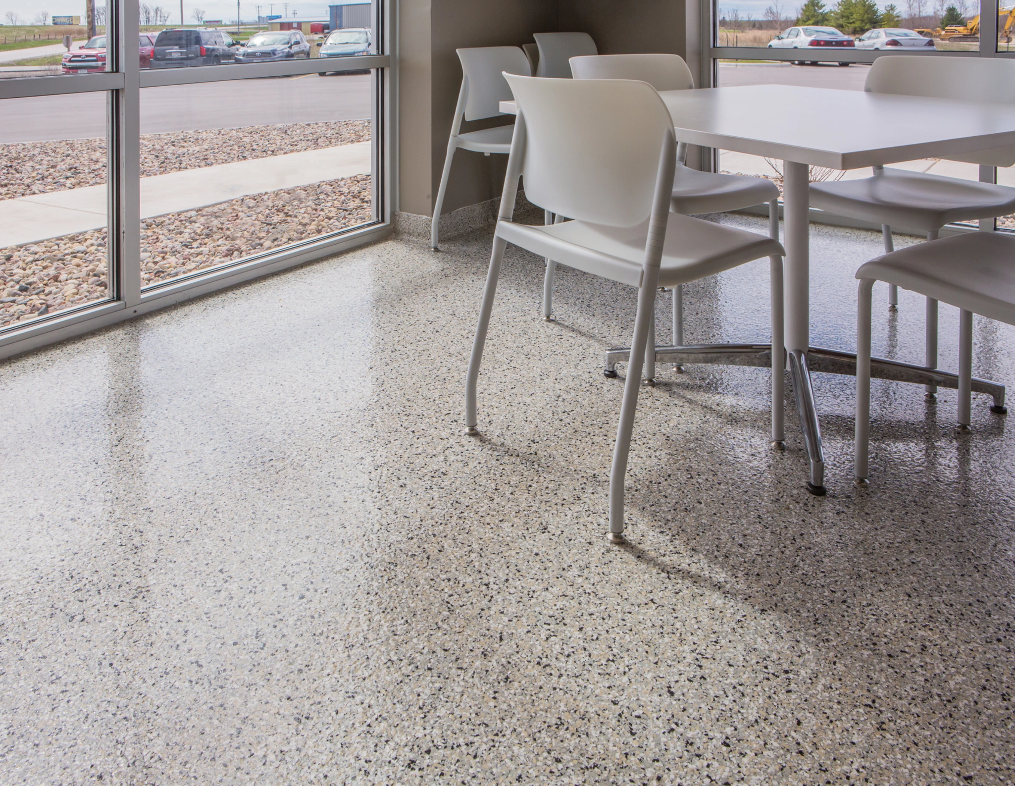 Epoxy floor coating in residential sitting area — seamless high-gloss finish