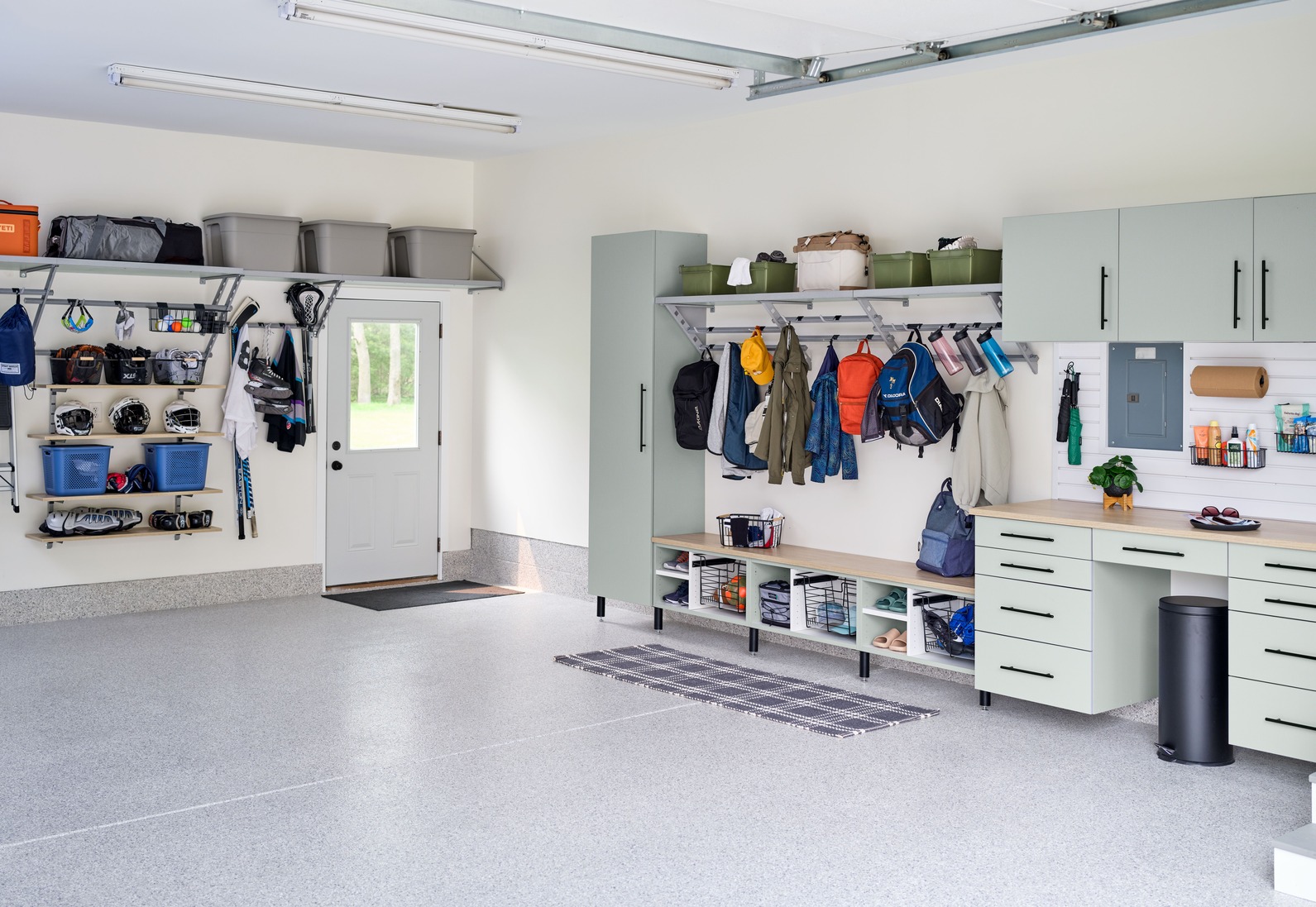 Complete garage transformation with wall racks and floor storage