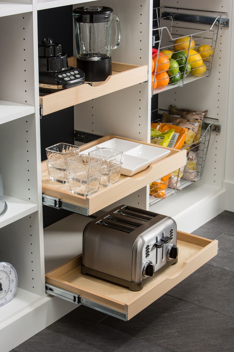 Custom pantry pull-out drawer detail with organized storage